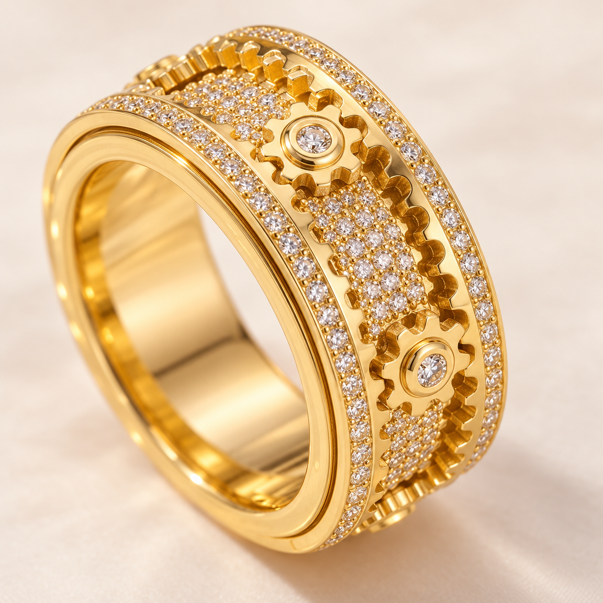 Close view of the gold ring's cog-wheel details and decorative band